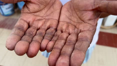 camera spinning around the hand of hard working man