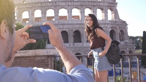 boyfriend taking pictures of his girlfriend