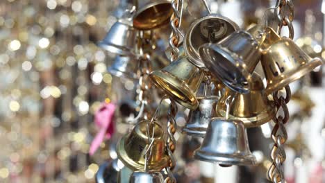 a cluster of bells swaying against a bokeh background