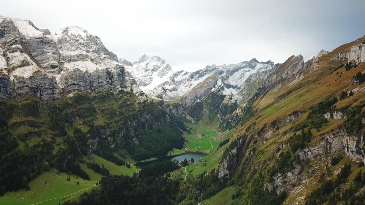 Beautiful drone views of the peaks of the mountains around Seealpsee, including Säntis at the right in Alpstein, Switzerland