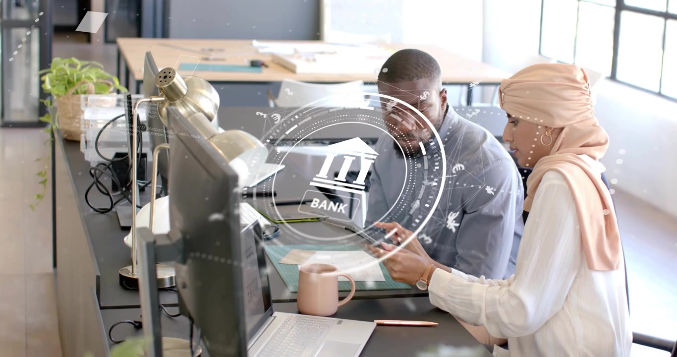 Bankers tilting tablet and tapping smartphone while analyzing holographic bank data swirling desk