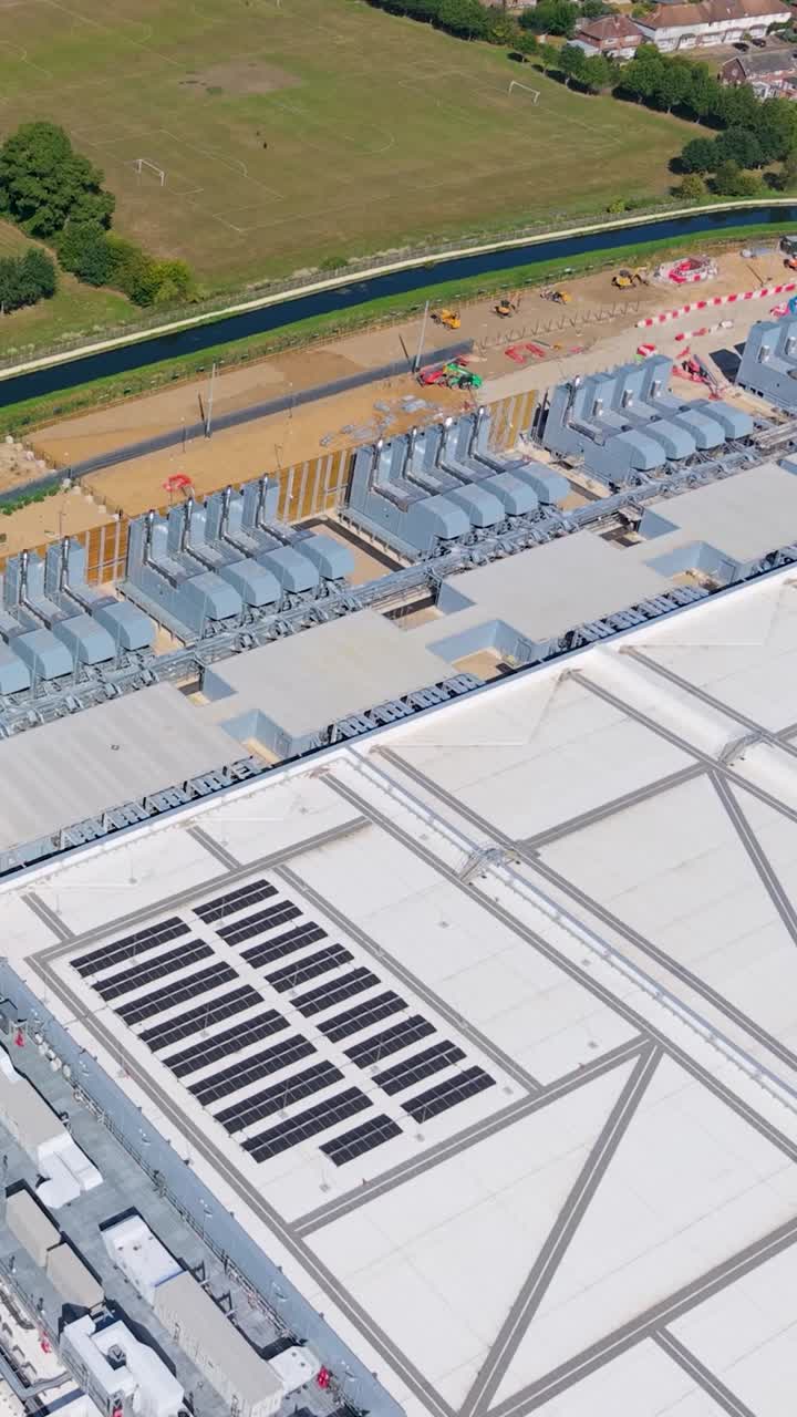 Vertical aerial drone footage showcasing the vast scale of Google’s data centre in Waltham Cross, Hertfordshire, highlighting architecture and size