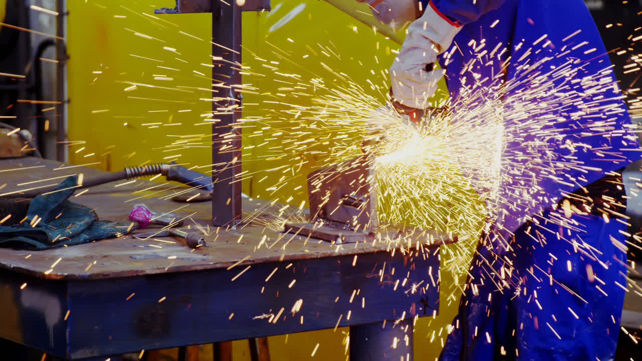 Male engineer using grinder machine 4k