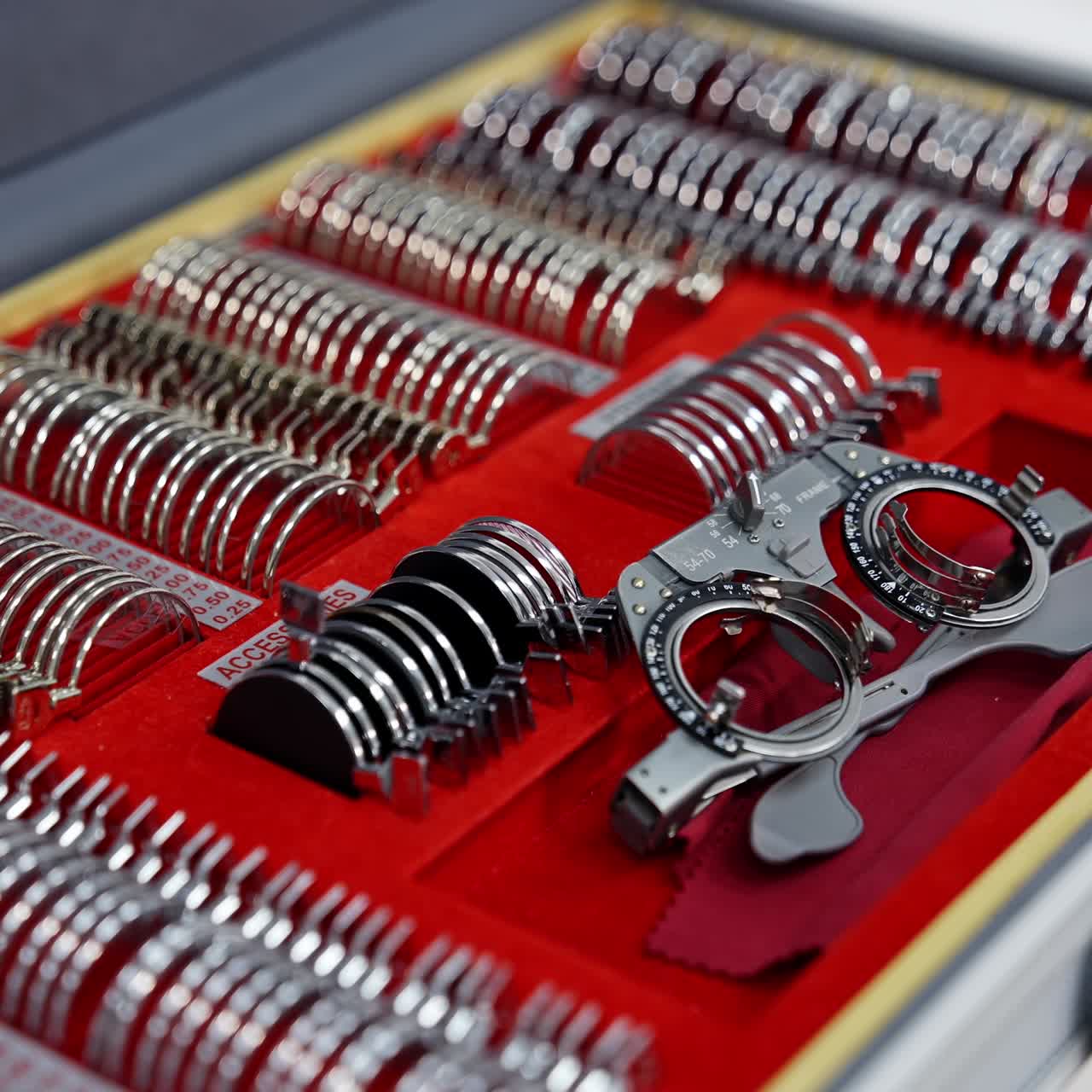 Set of different lenses in the case. Ophthalmologist's box with lenses for trial frame. Medical tools for spectacles. Close-up