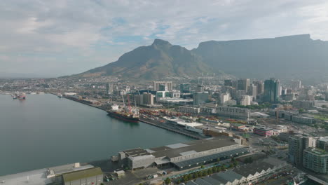 Coastal-borough-with-harbour.-Industrial-and-logistic-sites-in-city.-Flat-mountain-ridge-in-background.-Cape-Town,-South-Africa