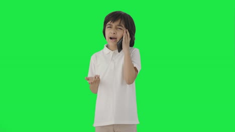 Angry-Indian-boy-talking-on-call-Green-screen