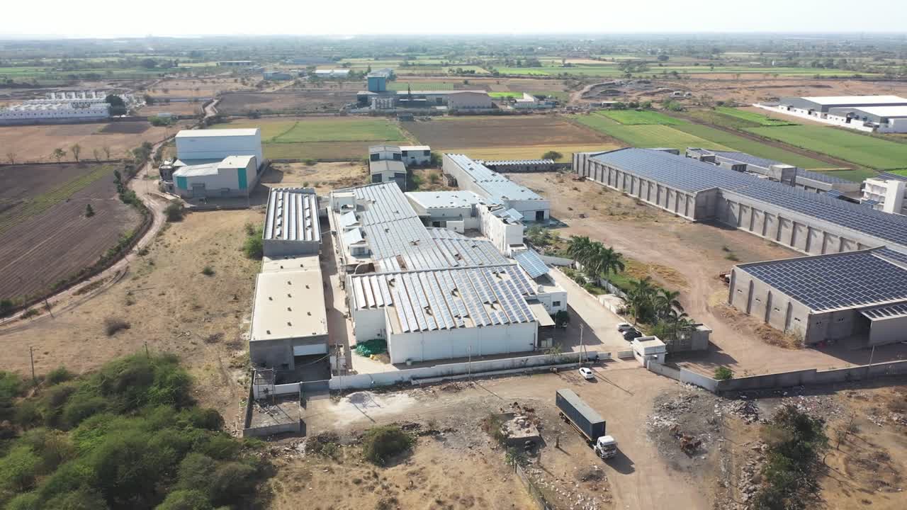 drone camera flight over factory the solar penal sun glare fell in the solar penal.4k video