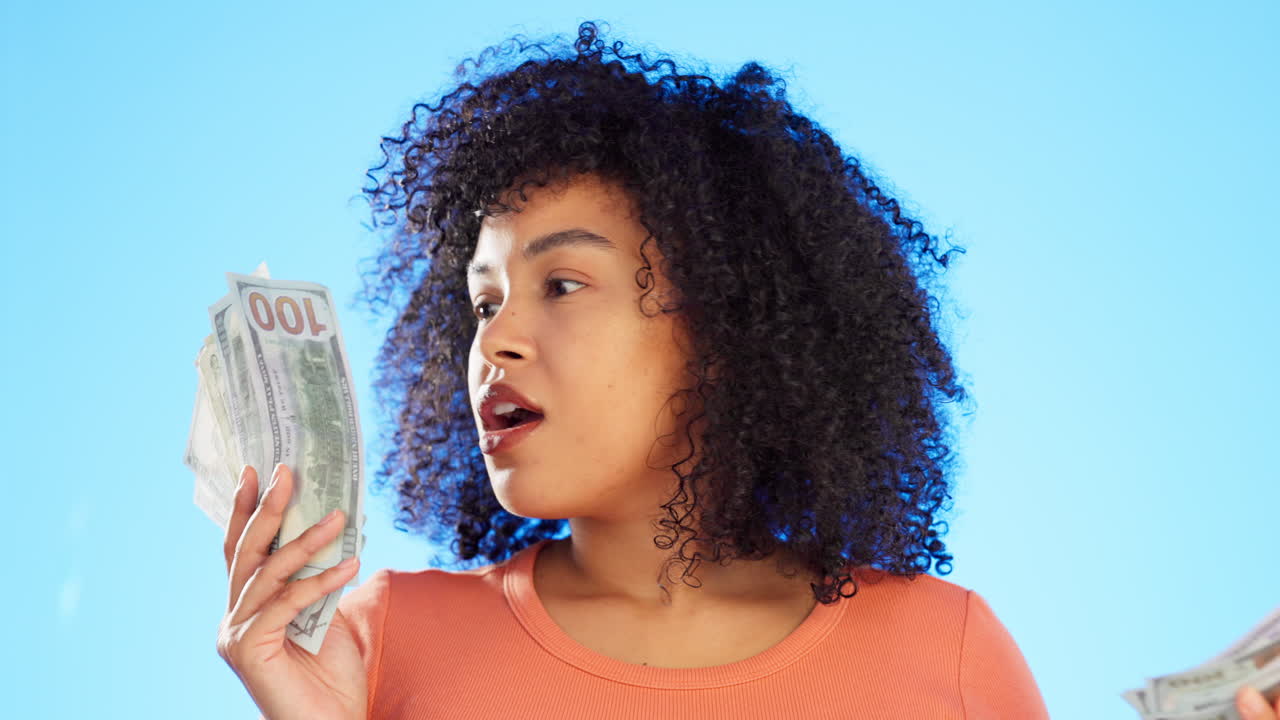 Dollars, winner and woman with money fan in studio