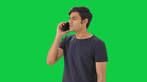 Angry-Indian-man-talking-to-someone-on-call-Green-screen