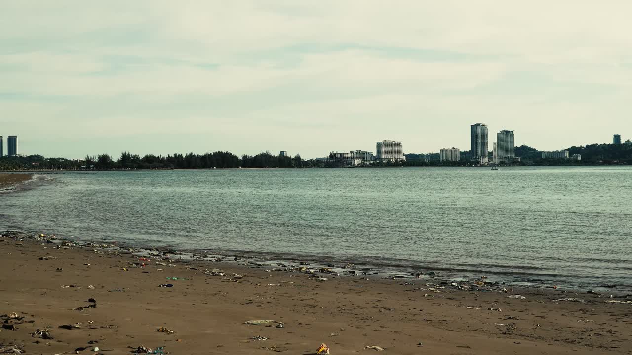 Summer Beautiful View Of Teluk Likas Beach, White Sandy Beach, Small Island, Blue sea water And Green Trees,Kota Kinabalu,Sabah,Malaysia.
