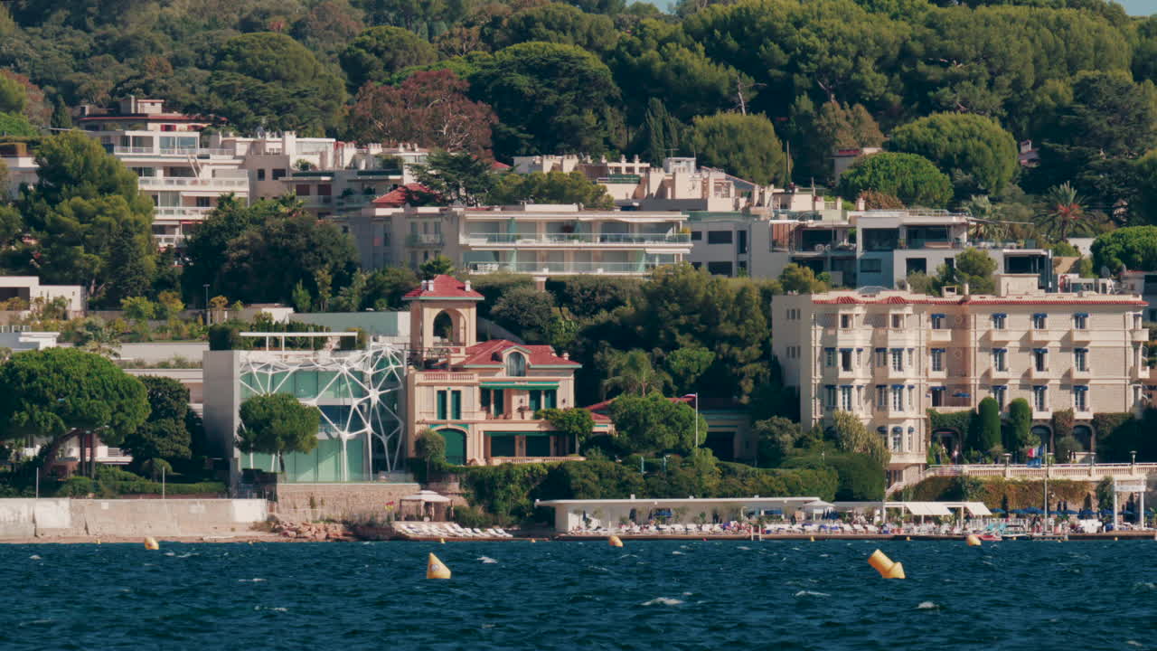 Panoramic view of modern villas and luxury hotels by the sea in Cannes, France