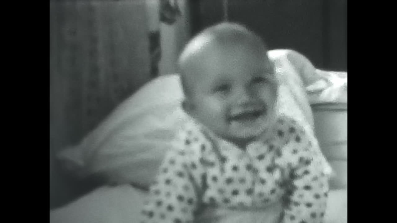 Distressed Baby Captured in a Powerful Black and White Video. CIRCA USSR 1980s: A striking black and white video of a crying baby, evoking emotion and capturing a snapshot of the human experience.