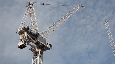 A-timelapse-of-a-crane-moving-against-the-clouds