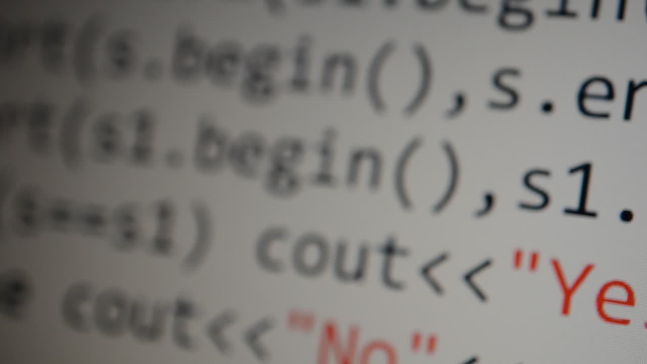 Source code on the monitor screen. Source code