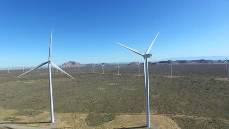 A-high-angle--aerial-over-a-Mojave-desert-wind-farm-as-it-generates-clean-energy-for-California-2