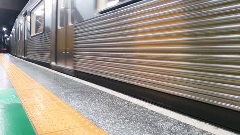 Moving-train-on-an-underground-platform-for-embarkation-and-disembarkation