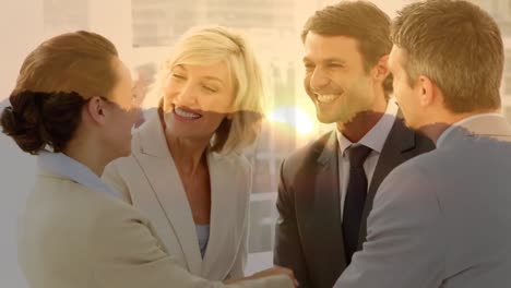 Animation-of-happy-caucasian-businesspeople-shaking-hands-over-landscape-at-sunset