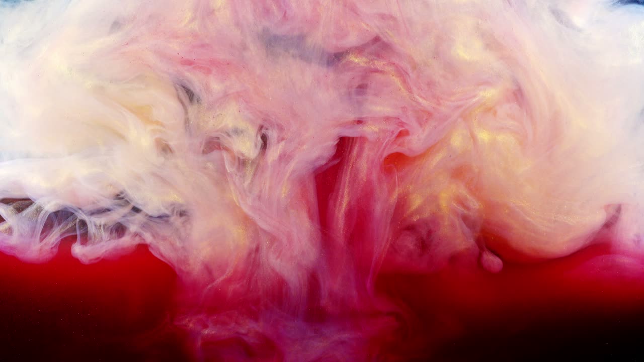 Abstract forms. Shooting on a black background. Mixing of paints