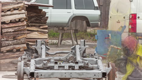 Person-cleaning-or-painting-whole-car-chassis,-fusion-time-lapse-shot