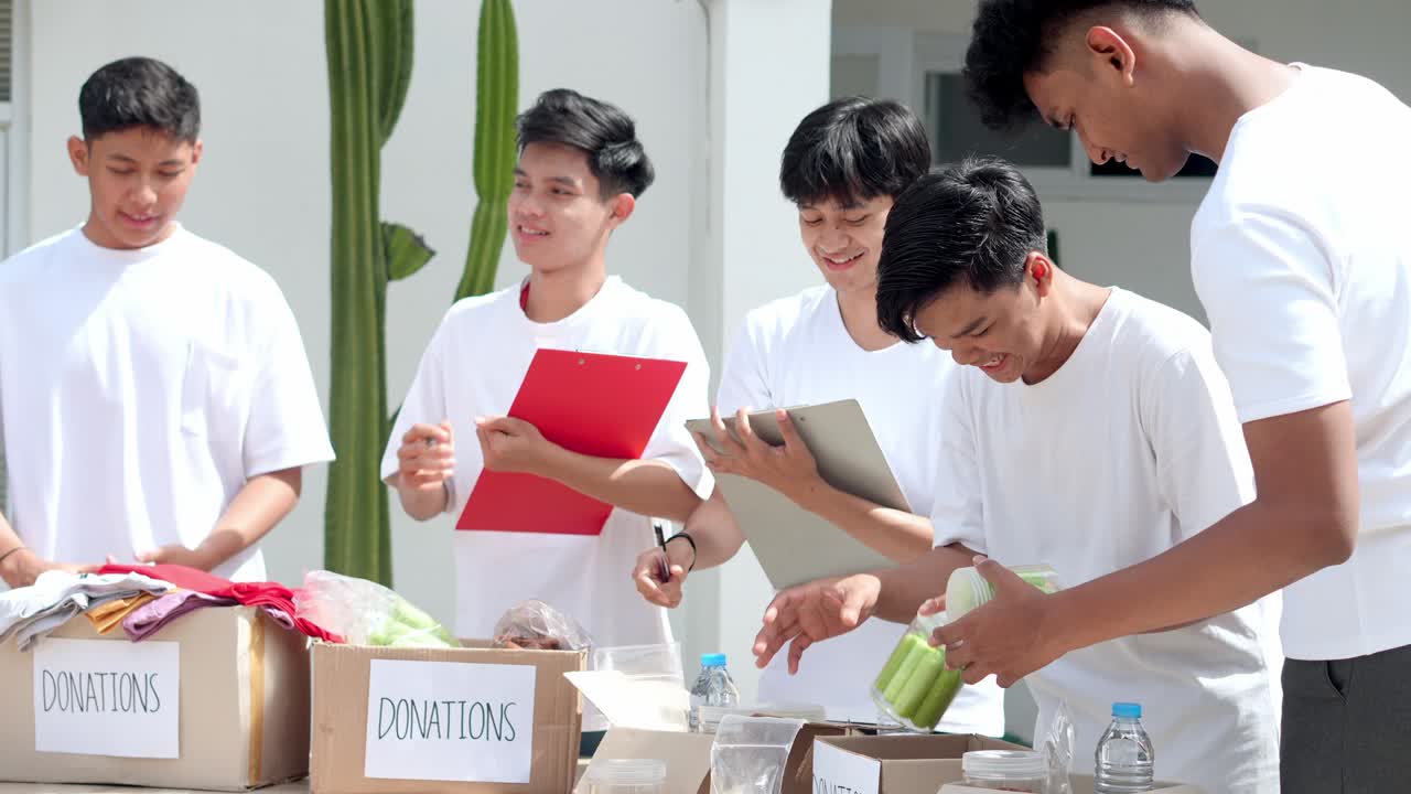 Group Of Volunteers Arranging Donation Stuff, Working as a Team to Help The Ones in Need