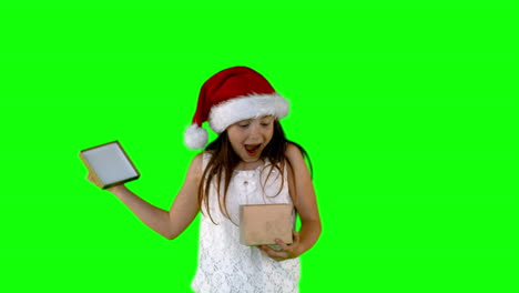 Festive-little-girl-opening-gift-in-slow-motion