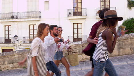 young adult friends walking in ibiza, spain, tracking shot, shot on r3d