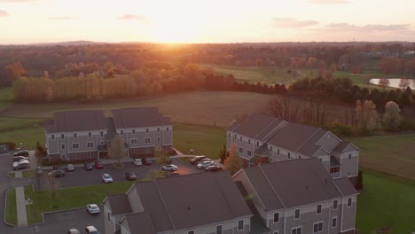 establishing shot of apartment building in usa at sunrise, sunset