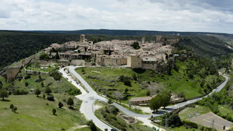 picturesque view of medieval walled spanish town of pedraza in segovia, spain