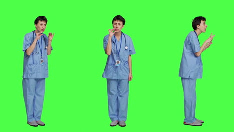 Medical-assistant-asking-to-keep-quiet-and-be-silent-against-greenscreen