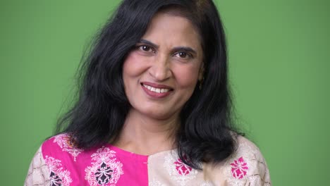 mature happy beautiful indian woman smiling while nodding head yes