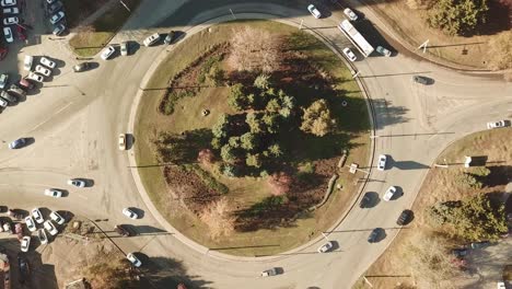 view from above at ring of car junction. traffic in city.