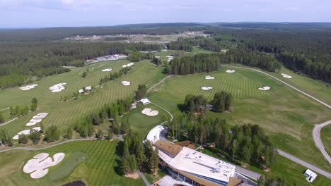 aerial view of a golf course with clubhouse