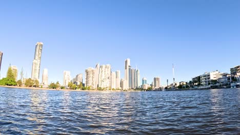 sunlit river view of gold coast skyline