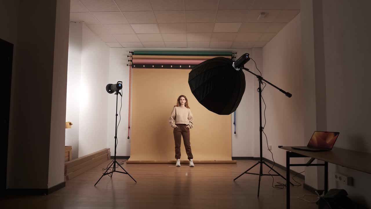 Young woman posing for shoot in photo studio