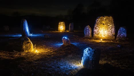 Mysterious Stone Circle Illuminated at Night, Featuring Unique Rock Formations Under a Starry Sky with Soft Blue and Orange Lights Highlighting the Surroundings