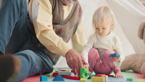 building blocks, playful and senior man