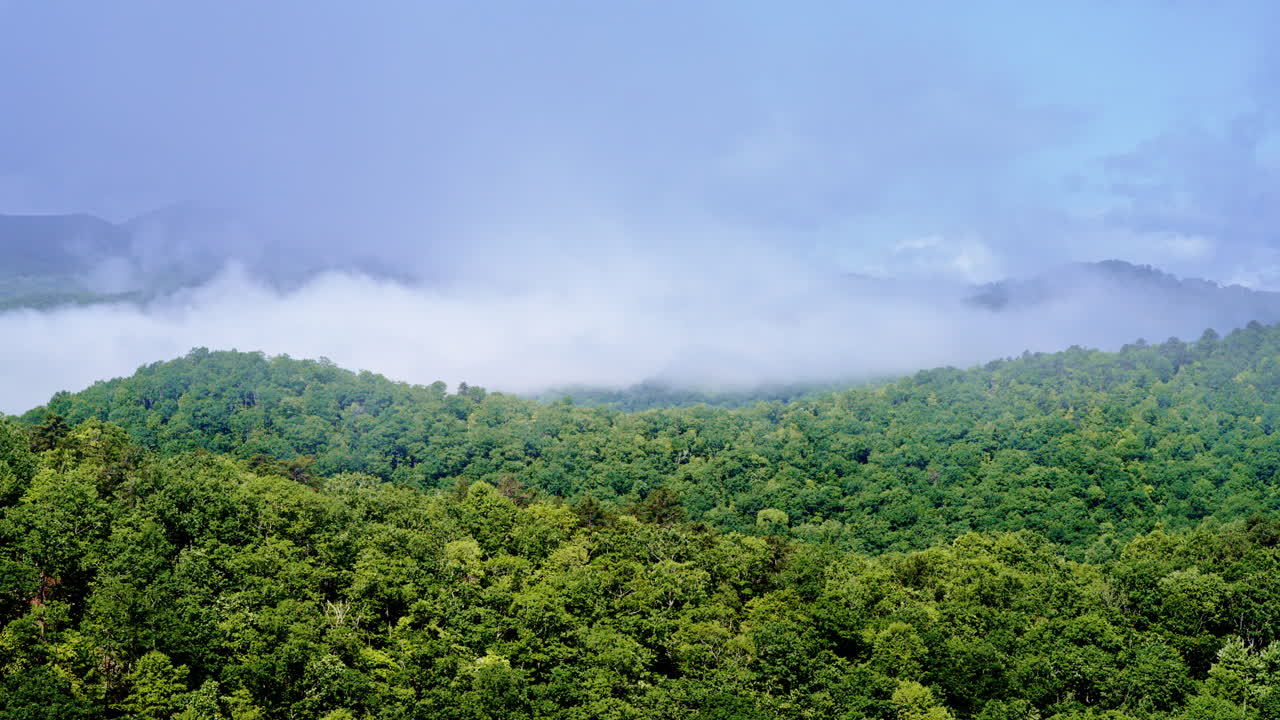 Cinematic drone slowly dissolving into a foggy horizon