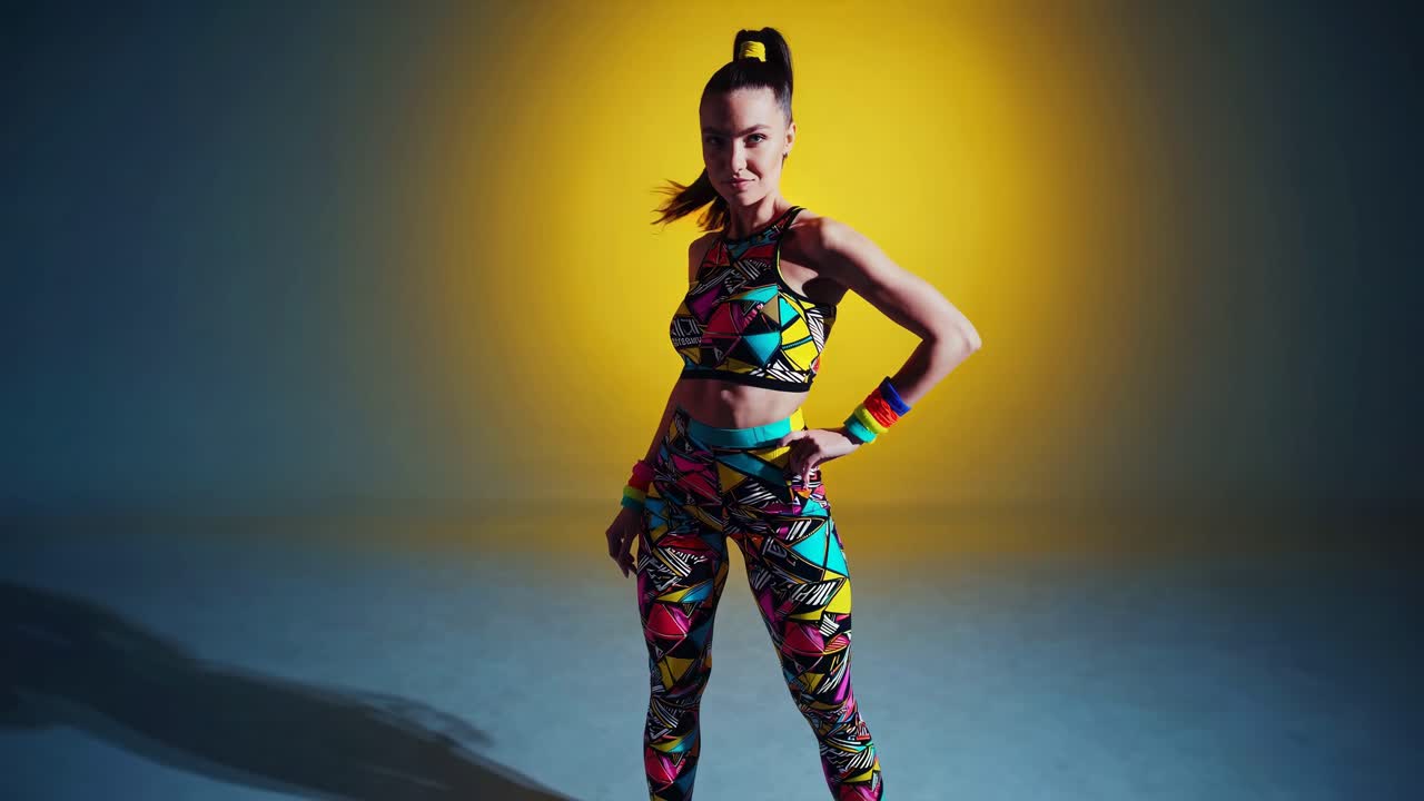 Woman in vibrant activewear, dancing or working out