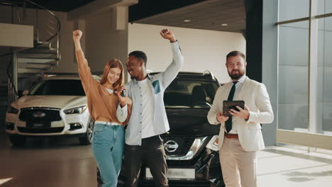 happy couple purchasing a new car