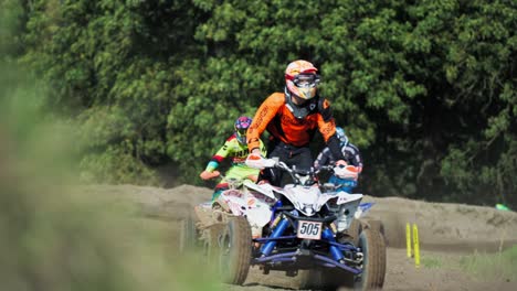 Group-of-riders-riding-atv-vehicle-on-off-road-track-during-off-road-competition,-near-Berlin-Germany