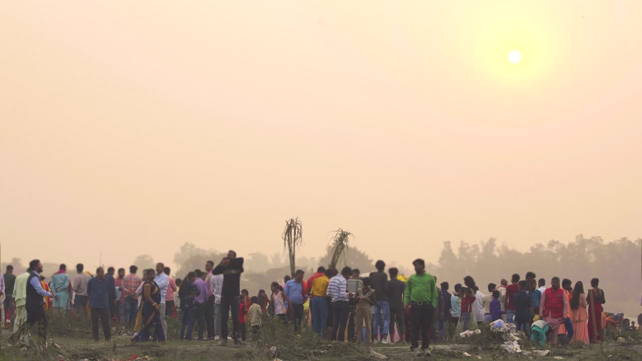Indian people standing at Yamuna riverside