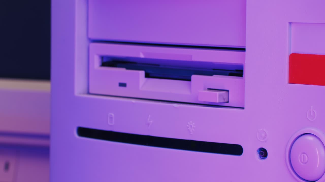 Inserting Floppy Disk into Retro Computer