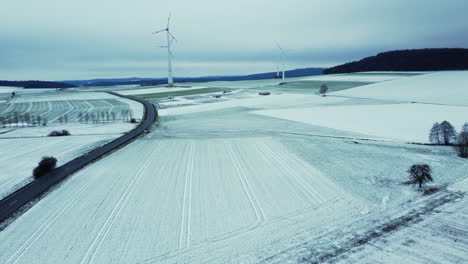 snowy landscape with wind turbines