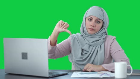 disappointed muslim businesswoman thumbs down green screen