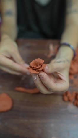 woman making a clay rose