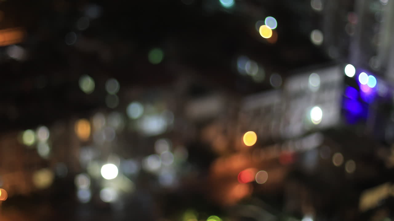 4k video Experimentation with out of focus color , abstraction and movement of cars at night in Havana Cuba