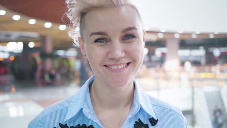 happy woman smiling in a shopping mall