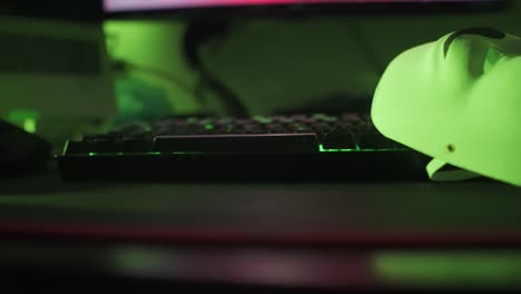 Side to Side Shot of Guy Fawkes Mask on LED Keyboard