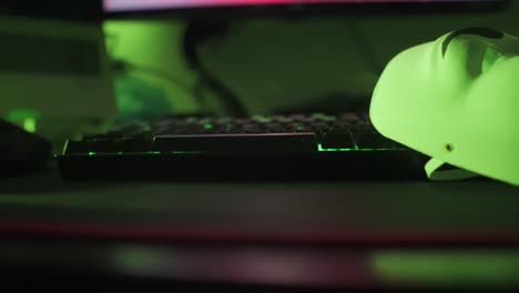 side to side shot of guy fawkes mask on led keyboard