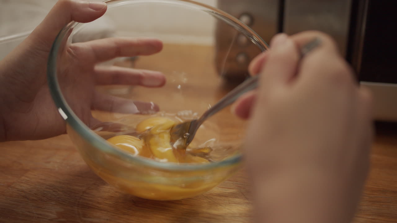 Close Up Beating Eggs in Bowl, Slow Motion